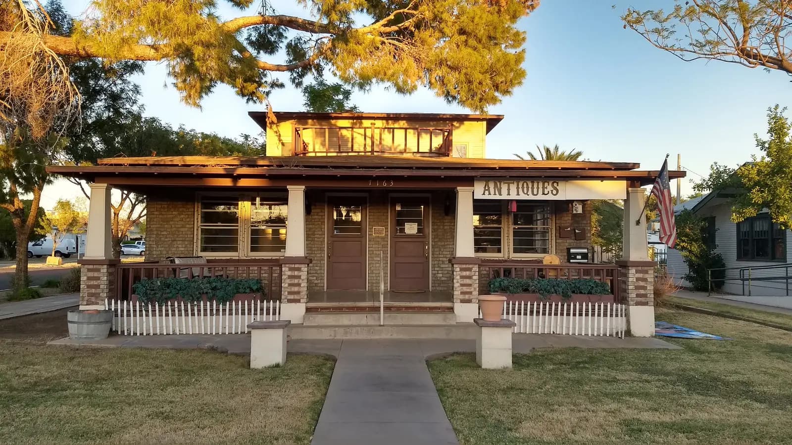 Historic Craftsman bungalow in Glendale's Catlin Court Historic District, lit by evening sun