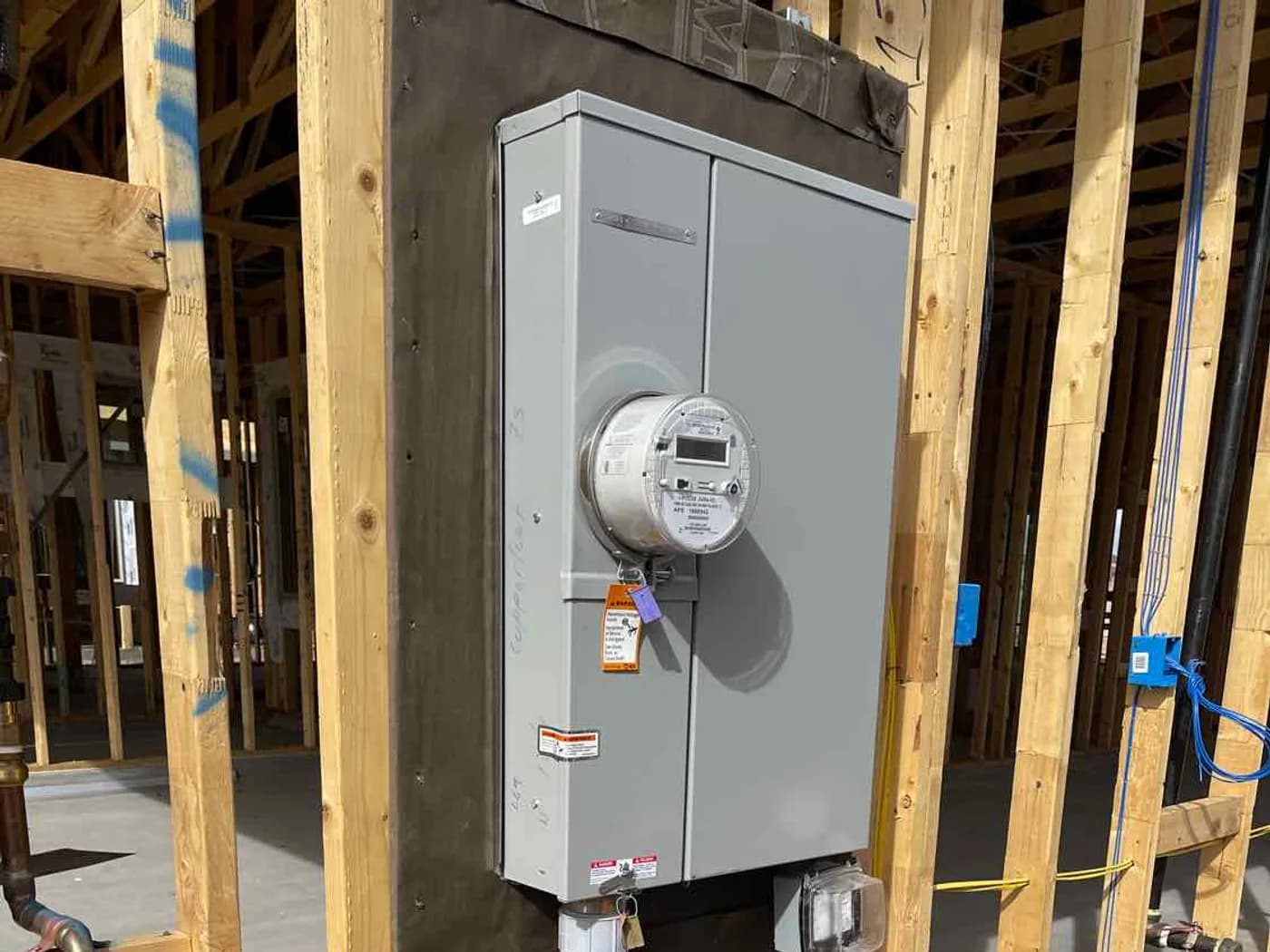 Electrical service and plumbing at the wall