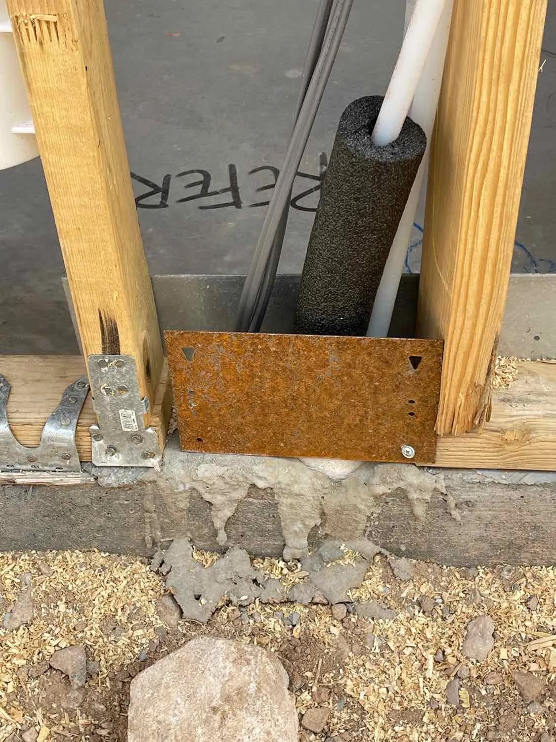 Slab-level plumbing and anchoring